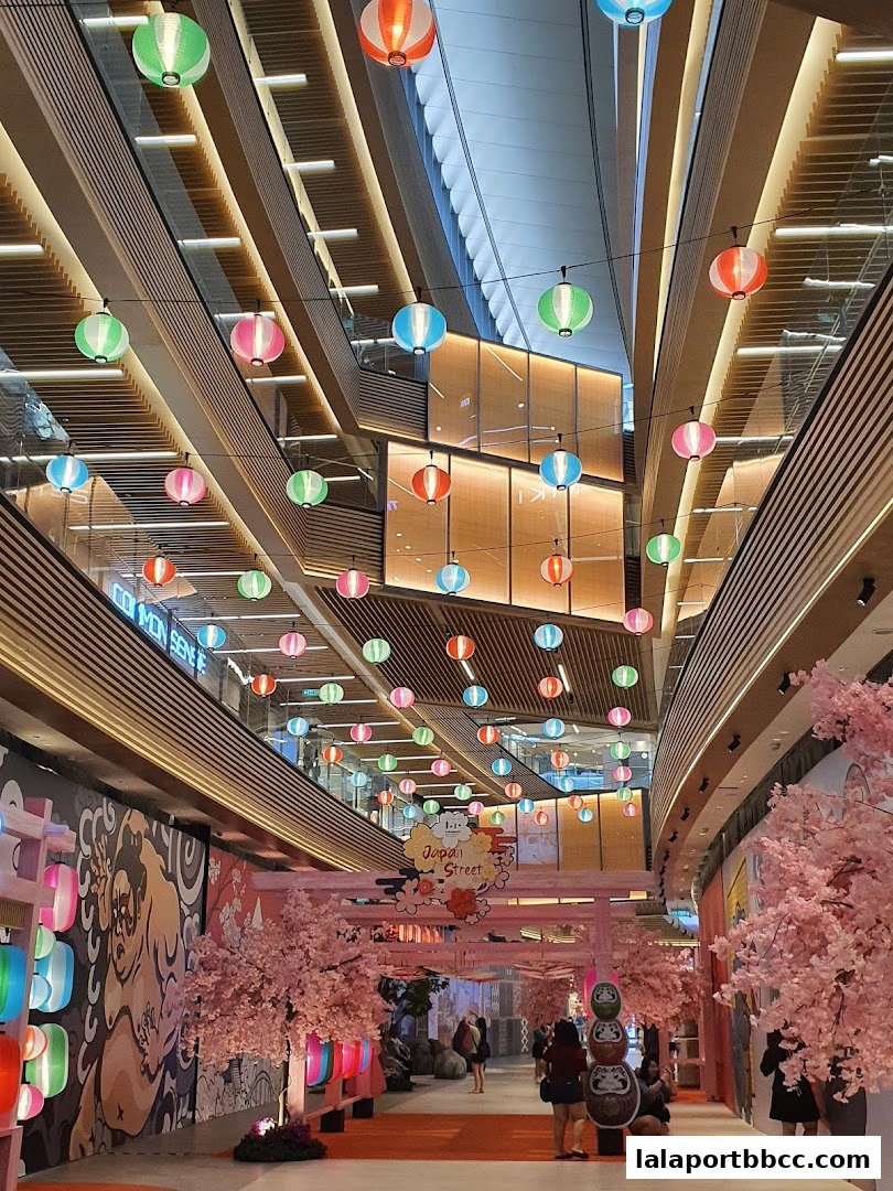 A vibrant Japanese street-themed area decorated with colorful lanterns and cherry blossom trees.