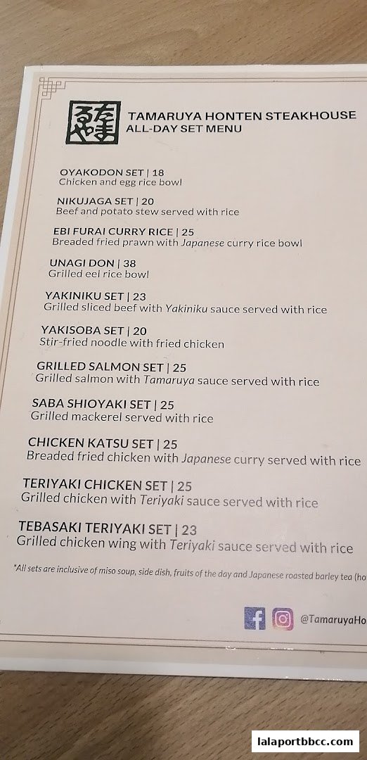 A menu from Tamaruya Honten Steakhouse featuring various set meals with descriptions and prices.