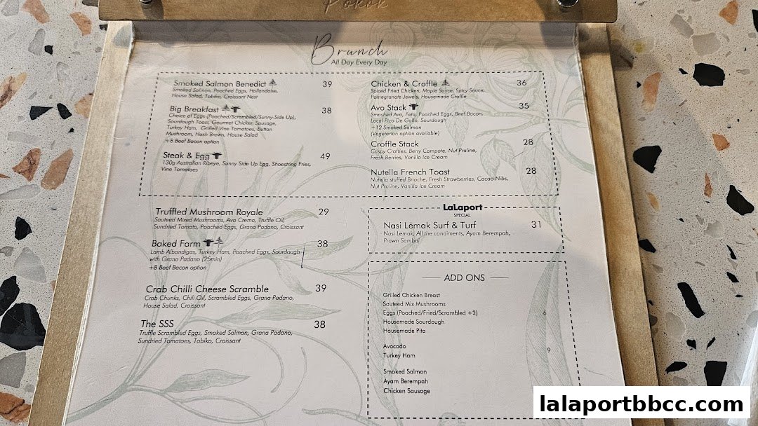 A menu from POKOK LaLaport featuring brunch items and add-ons.