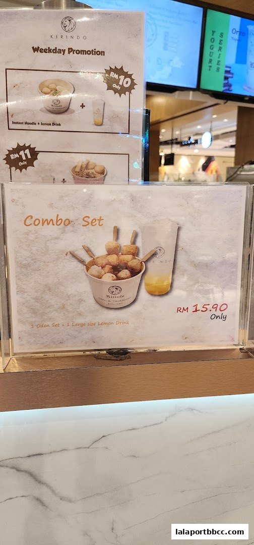 A menu board displaying promotions and combo sets from Kirindo.