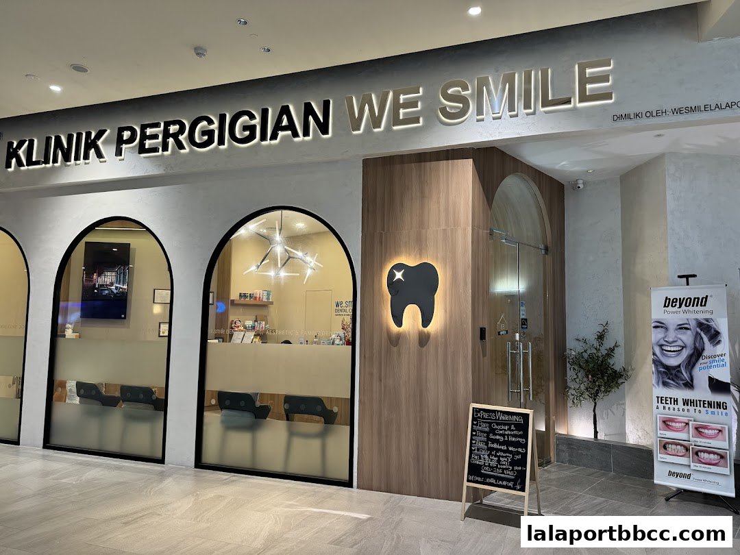 The modern entrance of WeSmile Dental Clinic, featuring a prominent sign and a promotional banner.