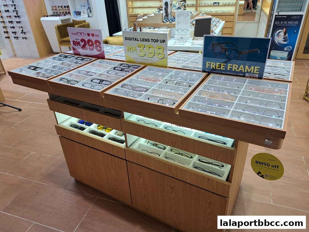 A display of eyeglasses and promotional signs inside an optical shop.