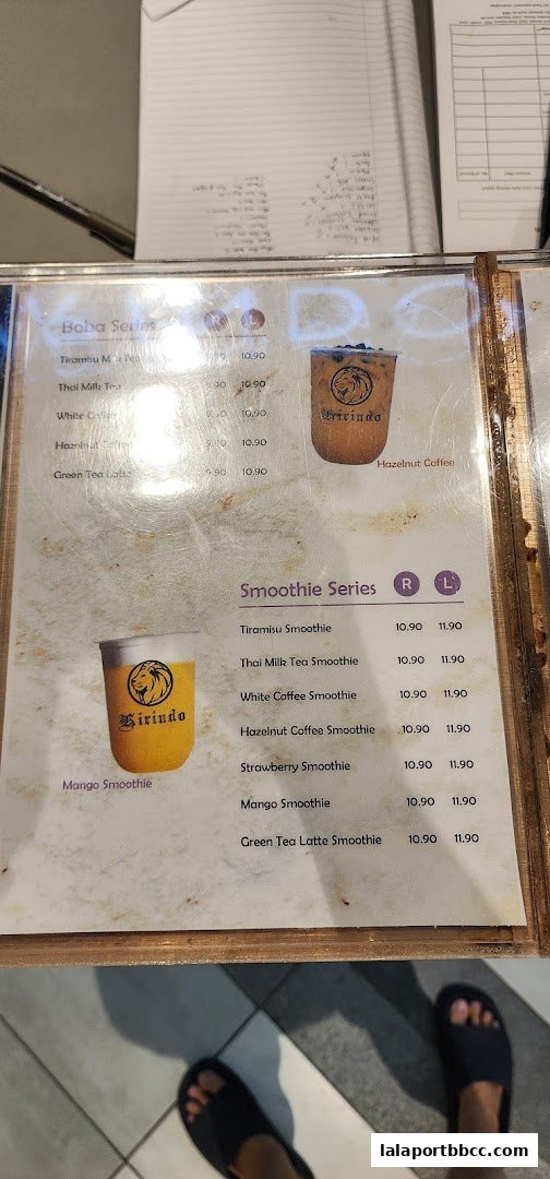 A menu displaying Boba and Smoothie series with prices and images of drinks.