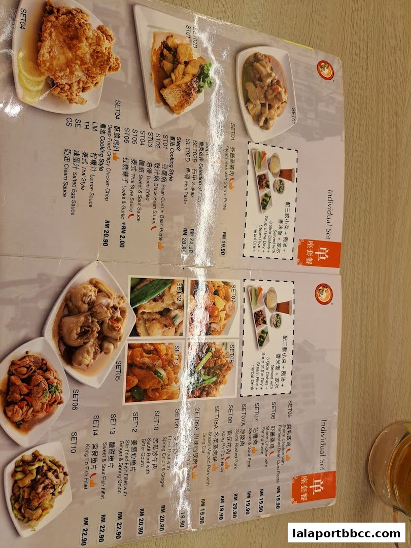 A menu from Sai Kee Restaurant LaLaport BBCC showcasing various set meals with food images and descriptions.