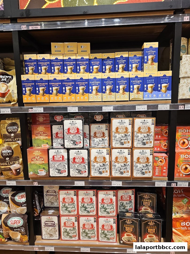 Shelves stocked with various coffee and tea products, including instant coffee mixes and latte varieties.