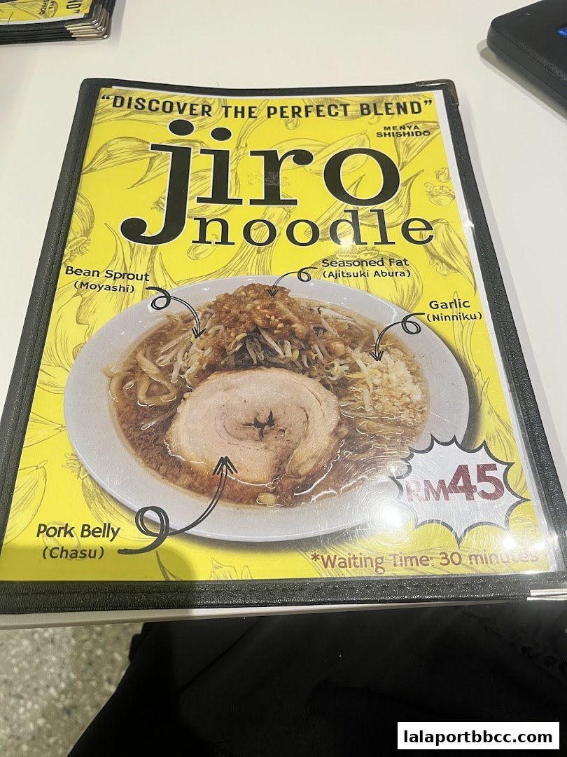 A menu featuring a bowl of Jiro style ramen with pork belly and various toppings.