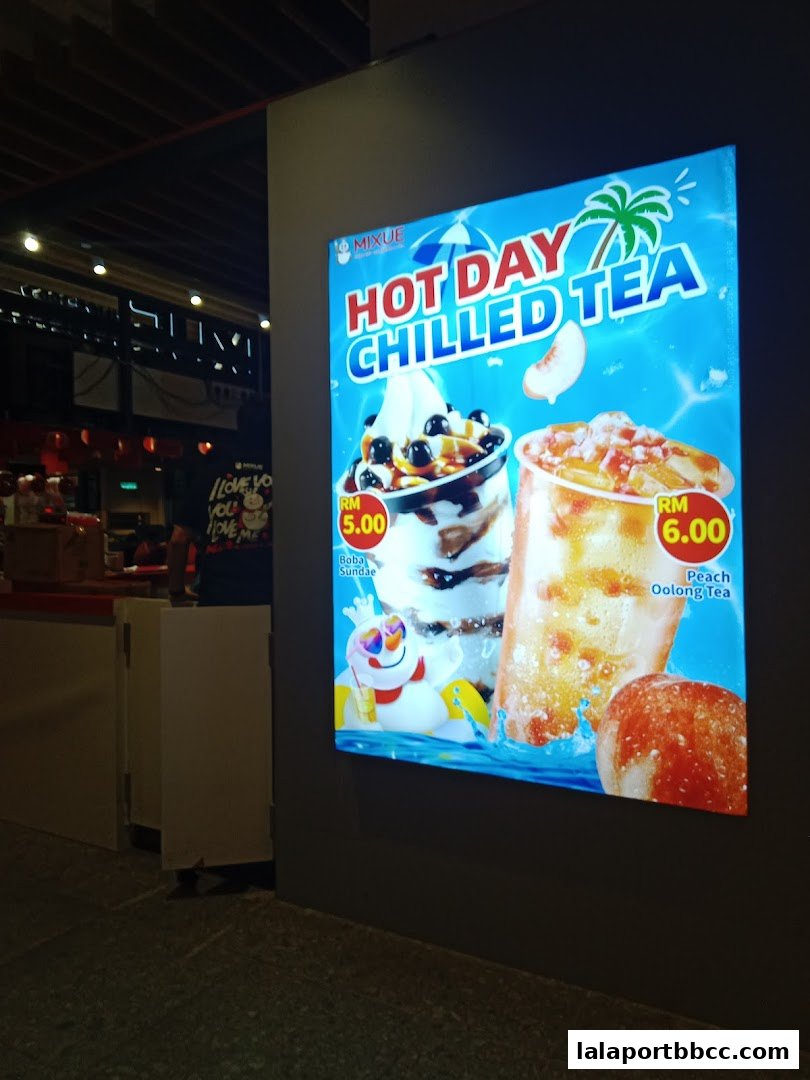 A glowing advertisement for Mixue's chilled teas and sundaes, featuring vibrant product images and prices.