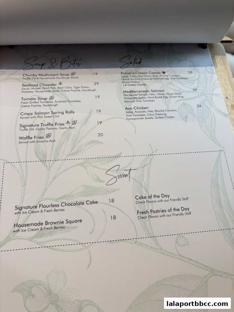 A menu from POKOK LaLaport featuring soups, salads, and desserts.