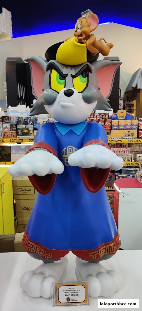 A large Tom and Jerry statue dressed in traditional Chinese attire with a price tag.