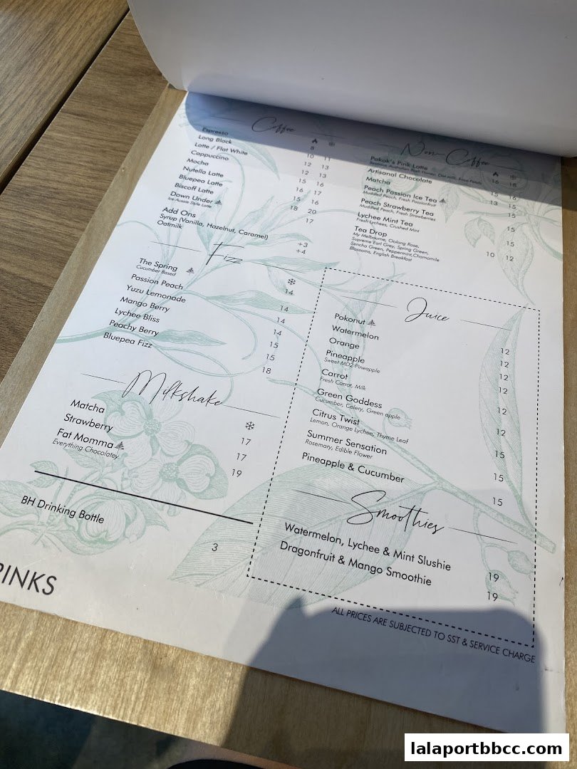 A menu from POKOK LaLaport featuring coffee, non-coffee drinks, juices, milkshakes, and smoothies.