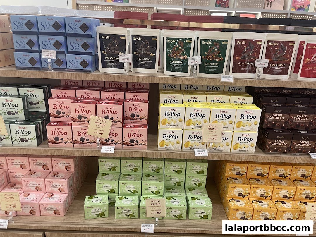 Shelves filled with various Beryls chocolate products, including Sea Salt, Cacao, Gianduja, B-Pop, and fruit-flavored bars.