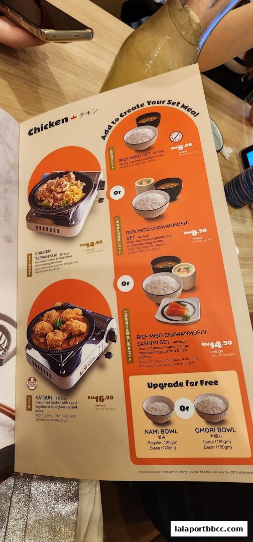 A menu from Sushi King Lalaport BBCC showcasing chicken dishes and set meal options.