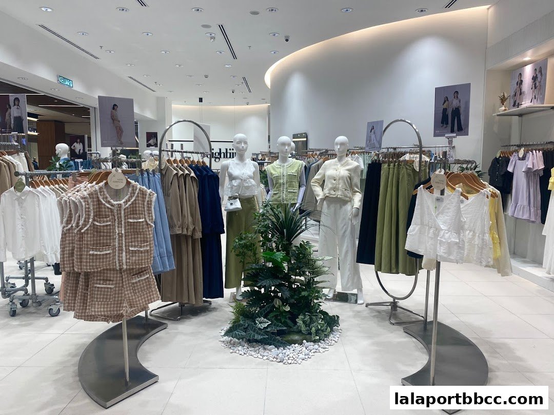 Mannequins and clothing displays inside a modern fashion boutique.