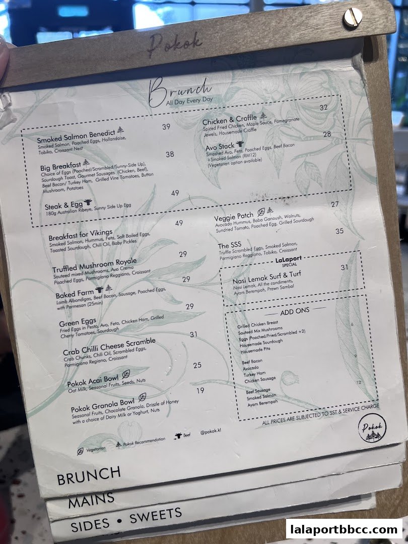 A menu from POKOK LaLaport featuring brunch items, mains, sides, and sweets.