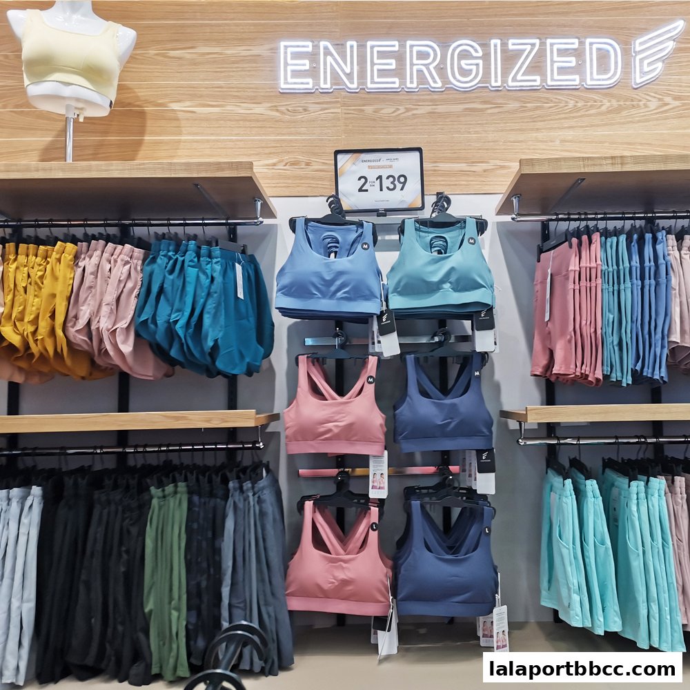 A display of athletic wear, including sports bras and shorts, in various colors.