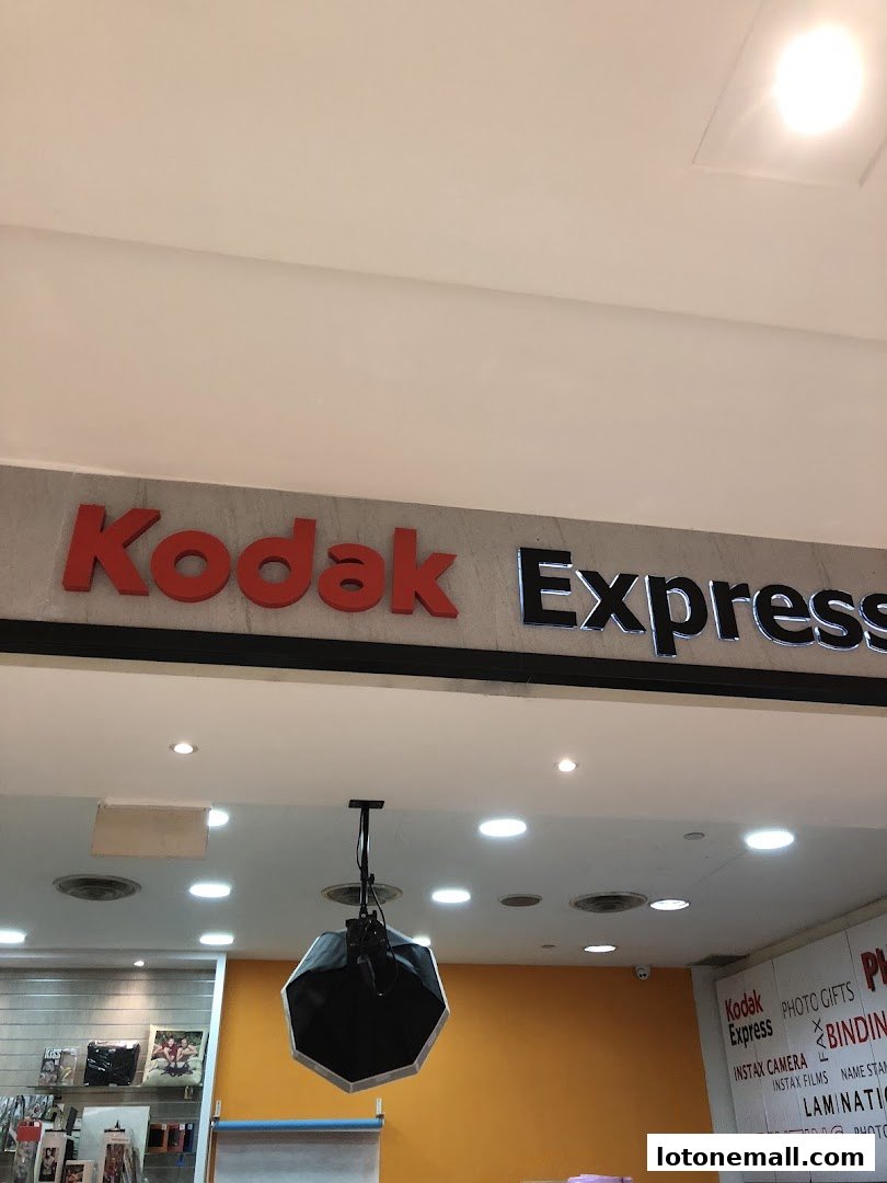 The Kodak Express shop sign and interior with photography equipment.
