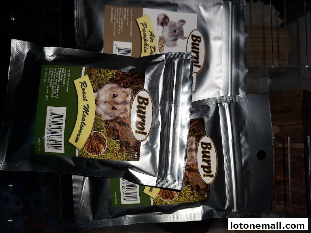 Several packages of pet treats, including roast mealworms and pumpkin seeds, are displayed.