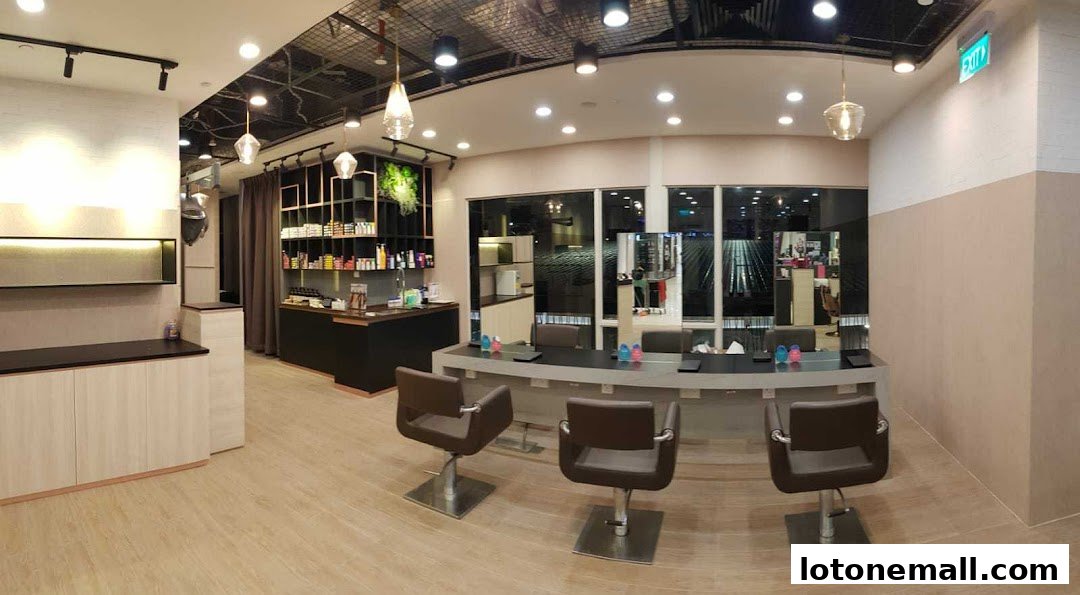 Interior of a modern hair salon with styling chairs, mirrors, and product shelves.