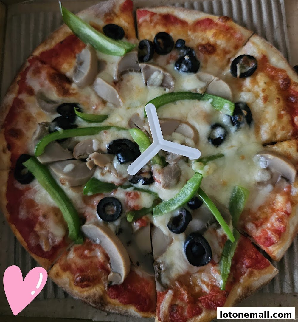 A delicious pizza topped with mushrooms, olives, and green peppers, ready to be enjoyed.
