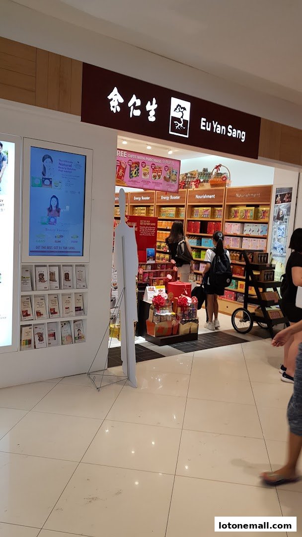 The exterior of the Eu Yan Sang shop, showcasing its products and signage.