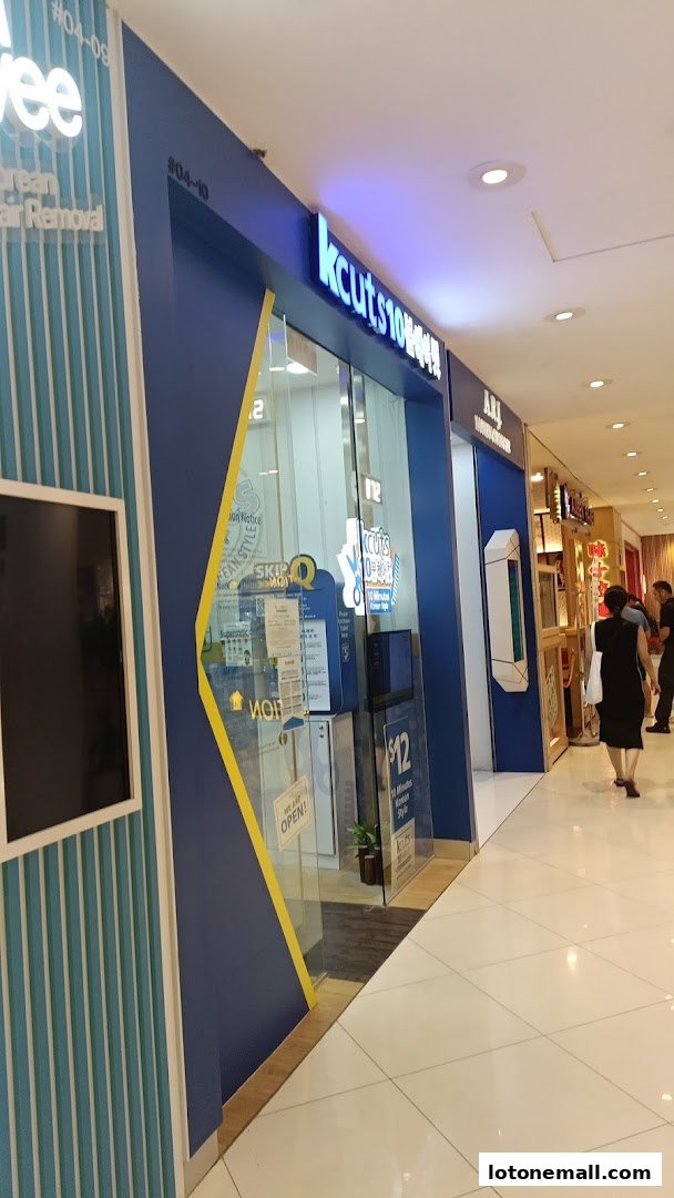 The exterior of a modern hair salon with a blue and yellow facade.