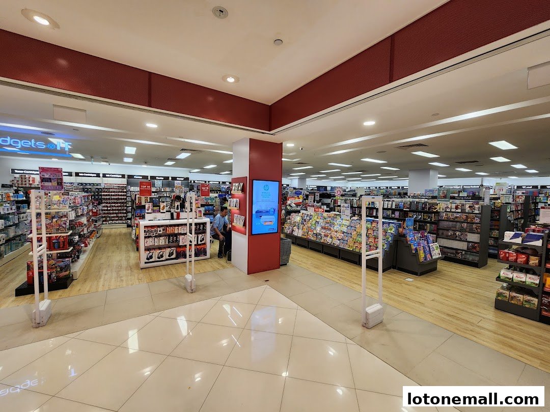 Interior view of a spacious POPULAR Bookstore with shelves stocked with books and merchandise.