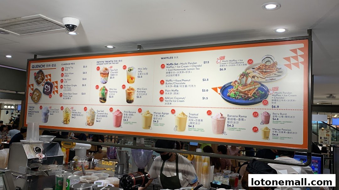 A menu board displaying various desserts and drinks, including waffles, smoothies, and traditional treats.