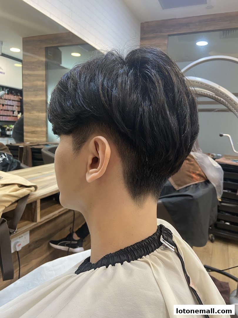 A person with a fresh haircut at Myeongdong Hair Studio.