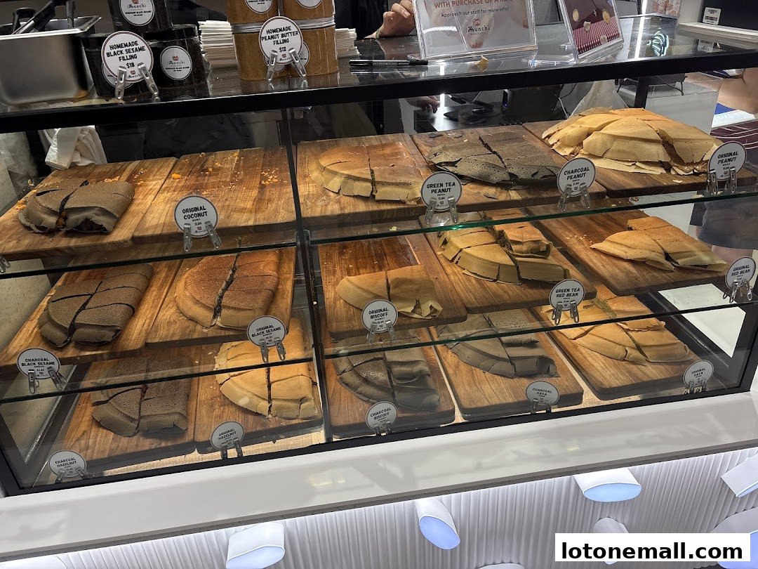 A display case filled with various flavors of sliced pancakes.