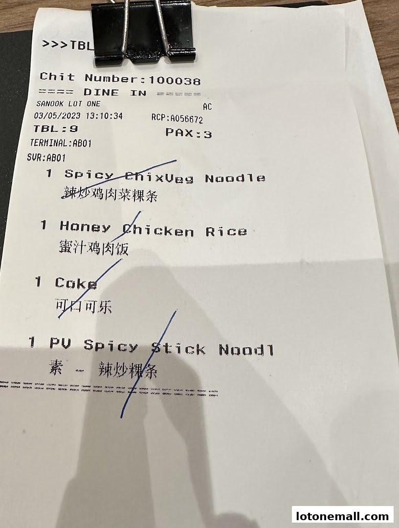 A receipt from Sanook Kitchen Lot One listing food and drink orders.