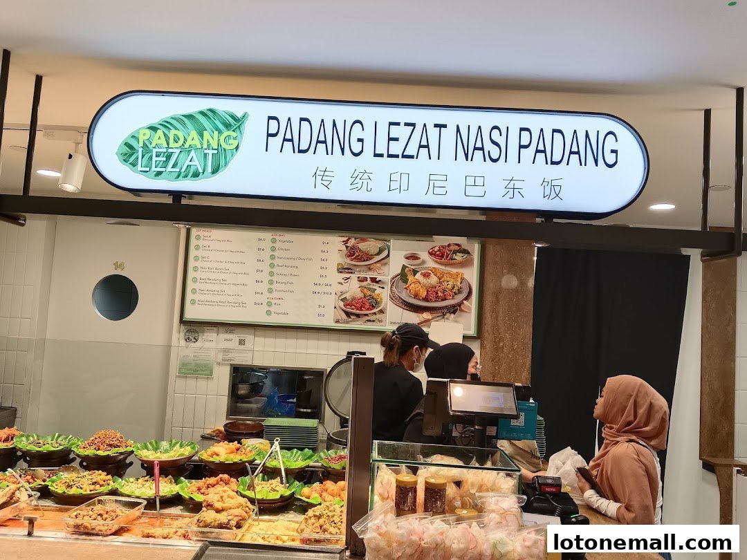 A food court stall with a variety of Indonesian dishes displayed and customers ordering.