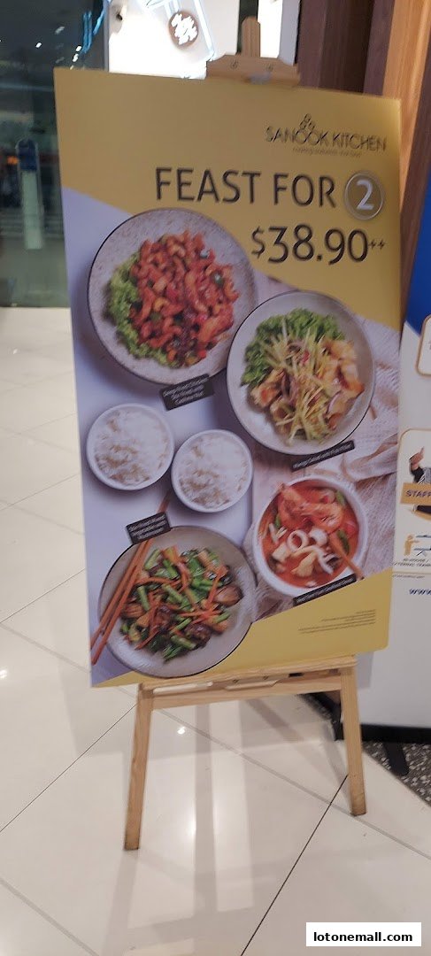 A promotional sign for Sanook Kitchen featuring a 'Feast for 2' meal deal.