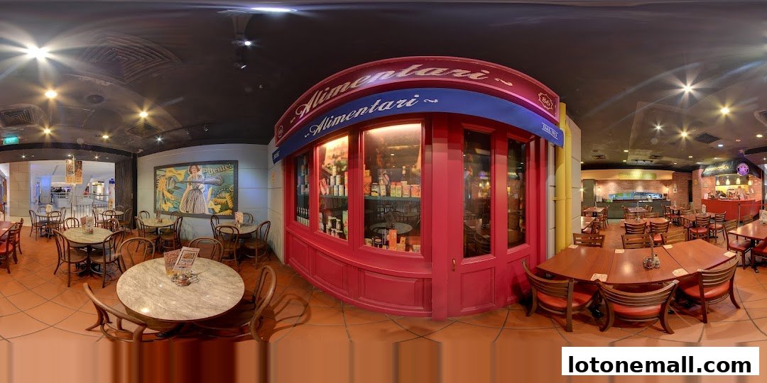 Interior view of PastaMania restaurant with tables, chairs, and a display of Italian goods.