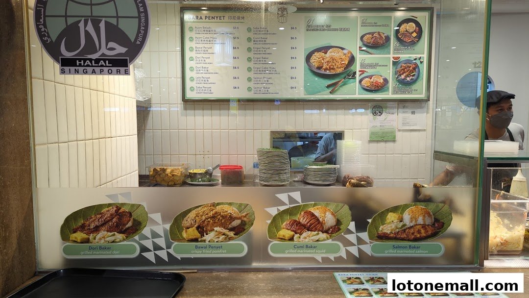 A food court stall displaying a menu with various grilled and fried dishes, including fish and squid.