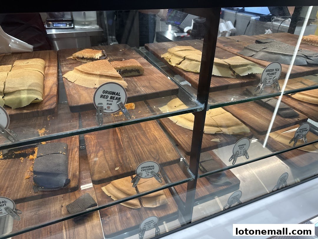 A display case filled with various flavors of pancakes at Munchi Pancakes.