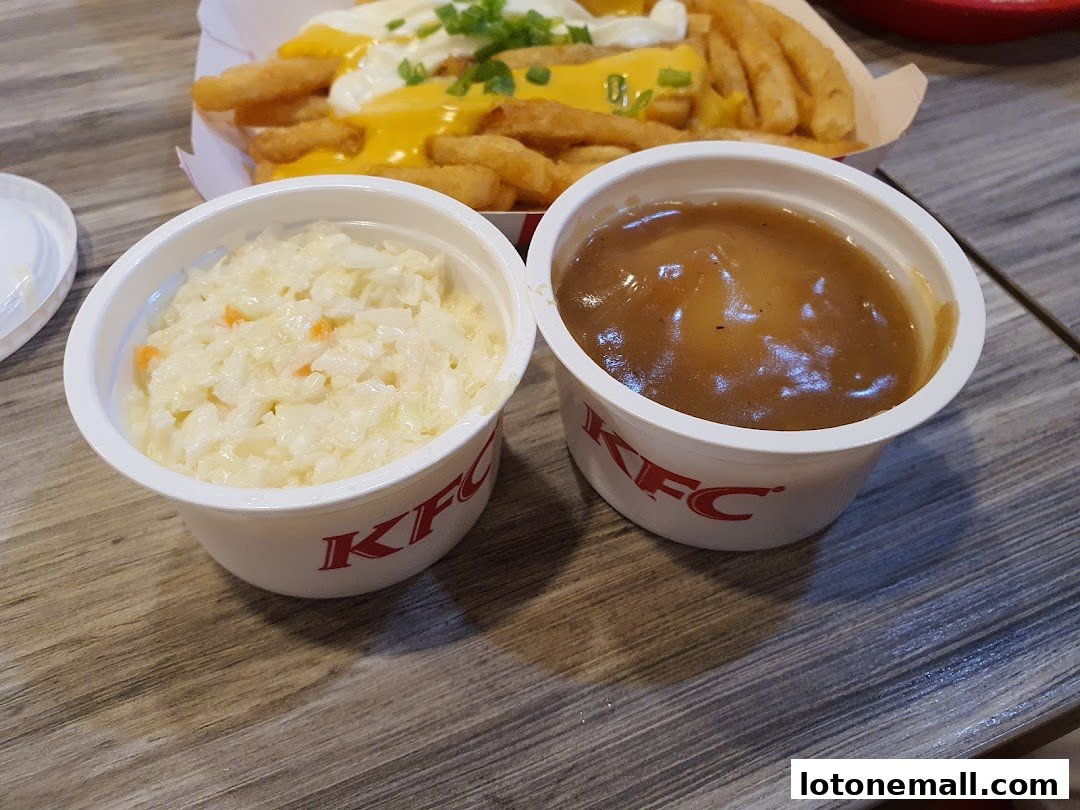 KFC coleslaw and gravy served in white cups with the KFC logo.