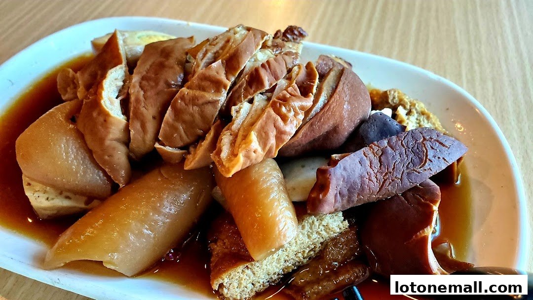 A plate of braised tofu, intestines, and other ingredients in a savory sauce.