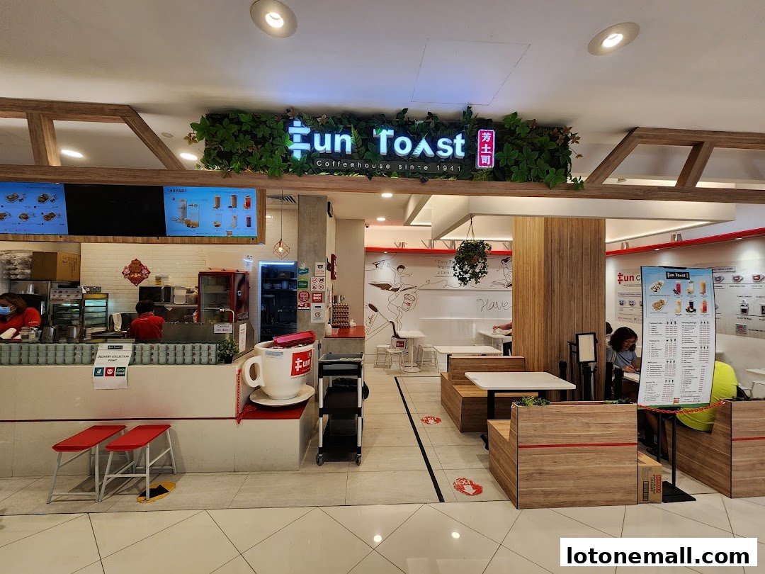 The entrance and interior of a Fun Toast coffeehouse with seating and a menu displayed.