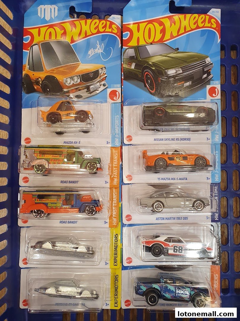 A collection of Hot Wheels toy cars in their original packaging, neatly arranged.