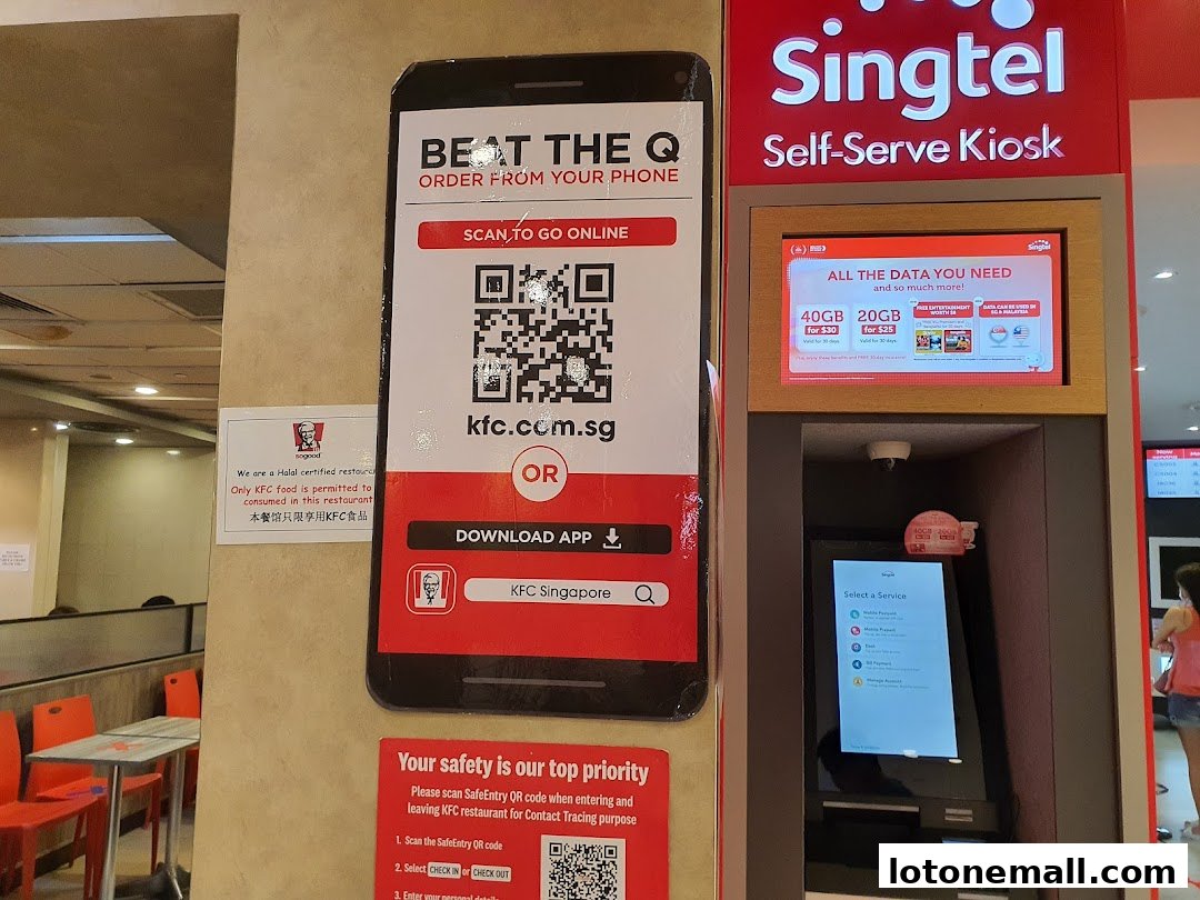 KFC restaurant with a QR code for ordering and a Singtel self-serve kiosk.