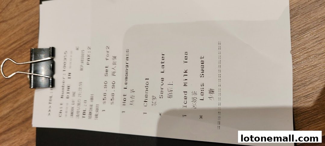 A receipt from Sanook Kitchen showing food and drink orders with prices.