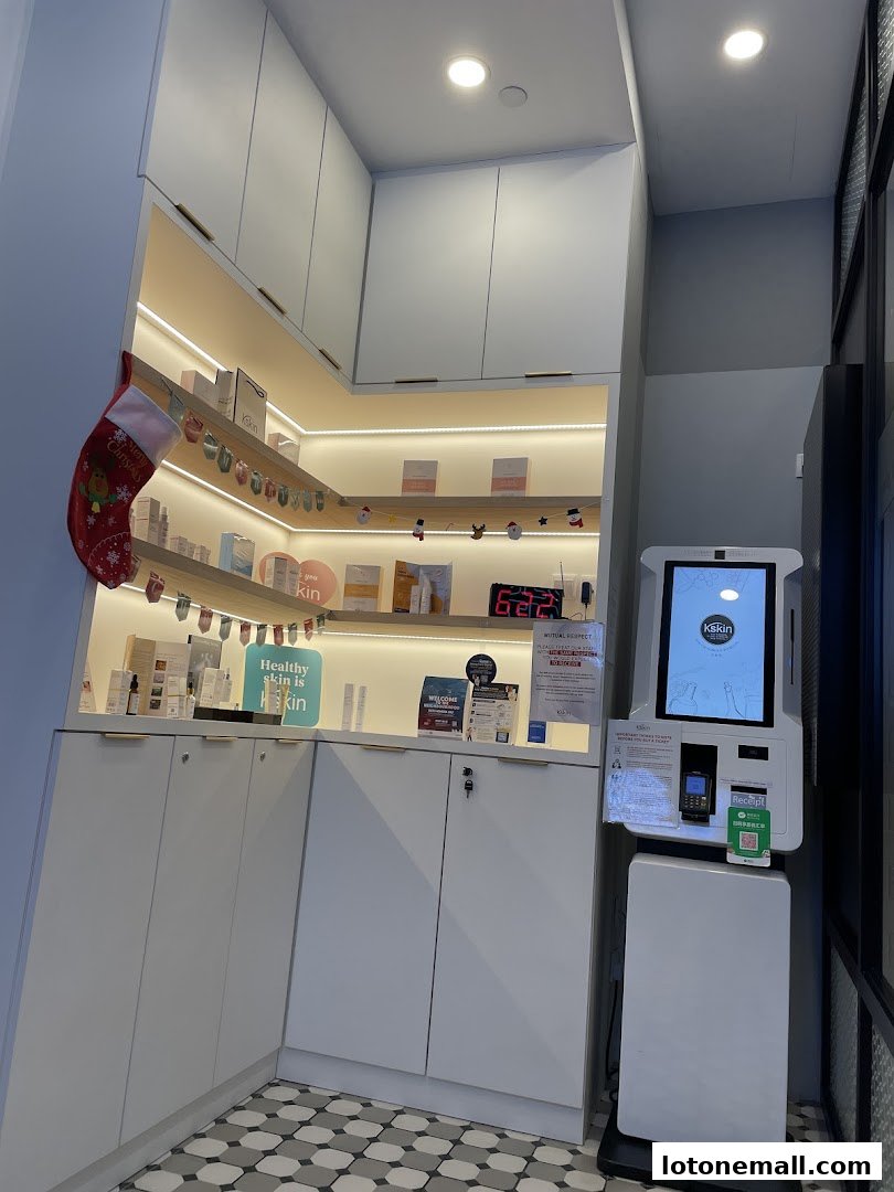 Interior view of a Kskin Korean Express Facial shop with products displayed and a self-service kiosk.