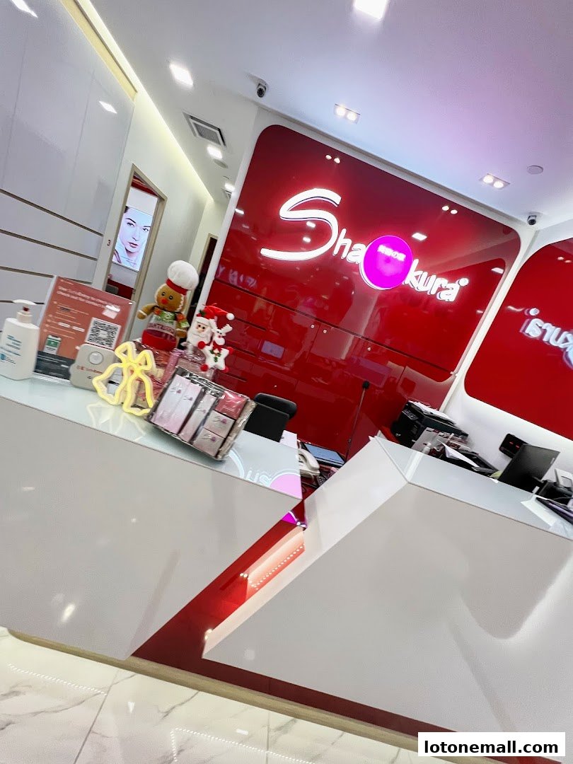 The interior of Shakura Pigmentation Beauty with a prominent red logo and reception desk.