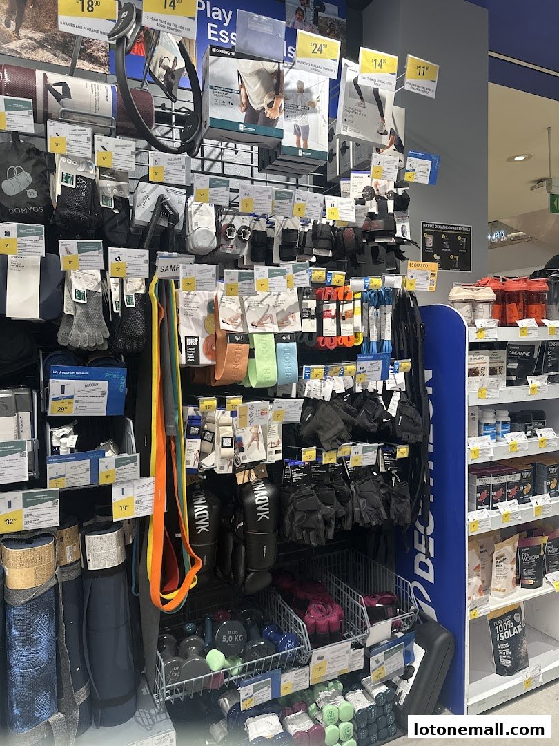 A wide selection of fitness accessories and equipment displayed on shelves and in baskets.