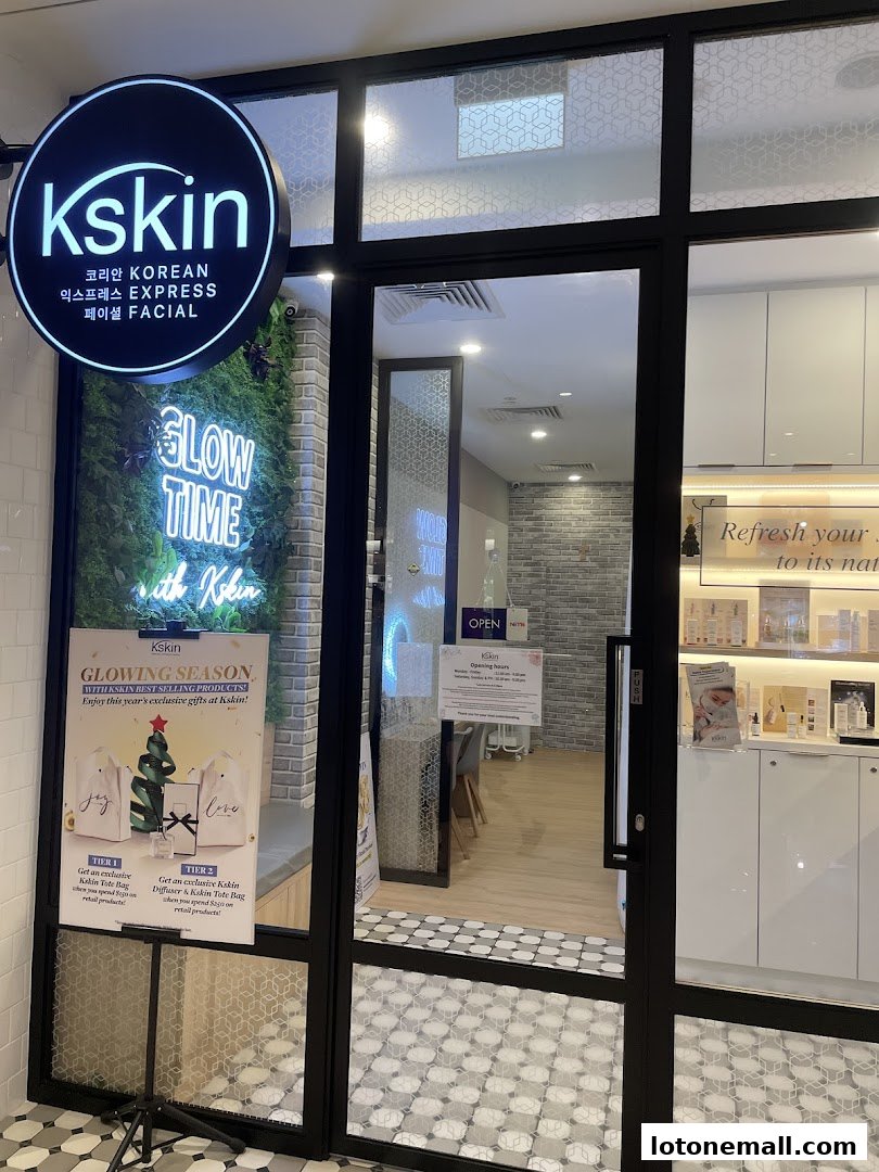 The entrance of Kskin Korean Express Facial shop with a neon sign and promotional posters.