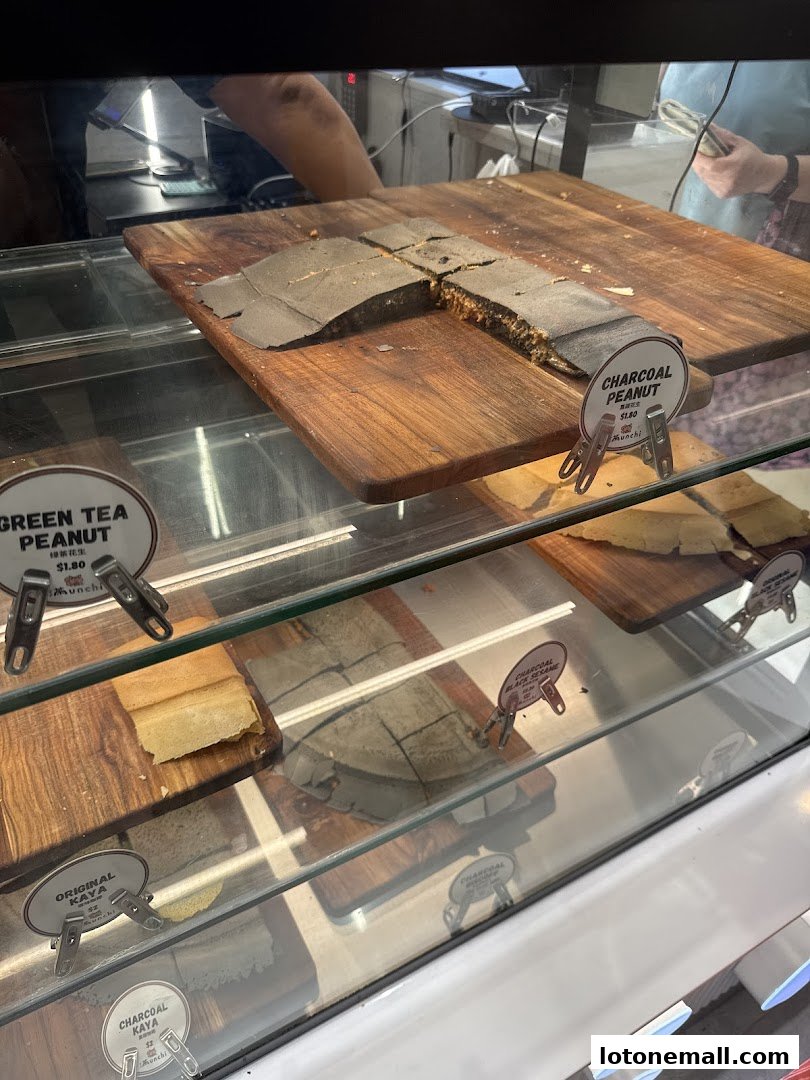 A display case filled with various types of pancakes and sweet treats.