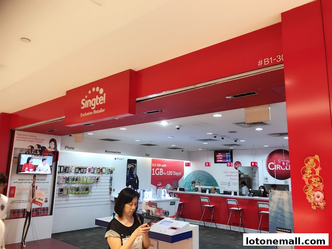 Singtel Exclusive Retailer shop interior with displays of phones, accessories, and a service counter.