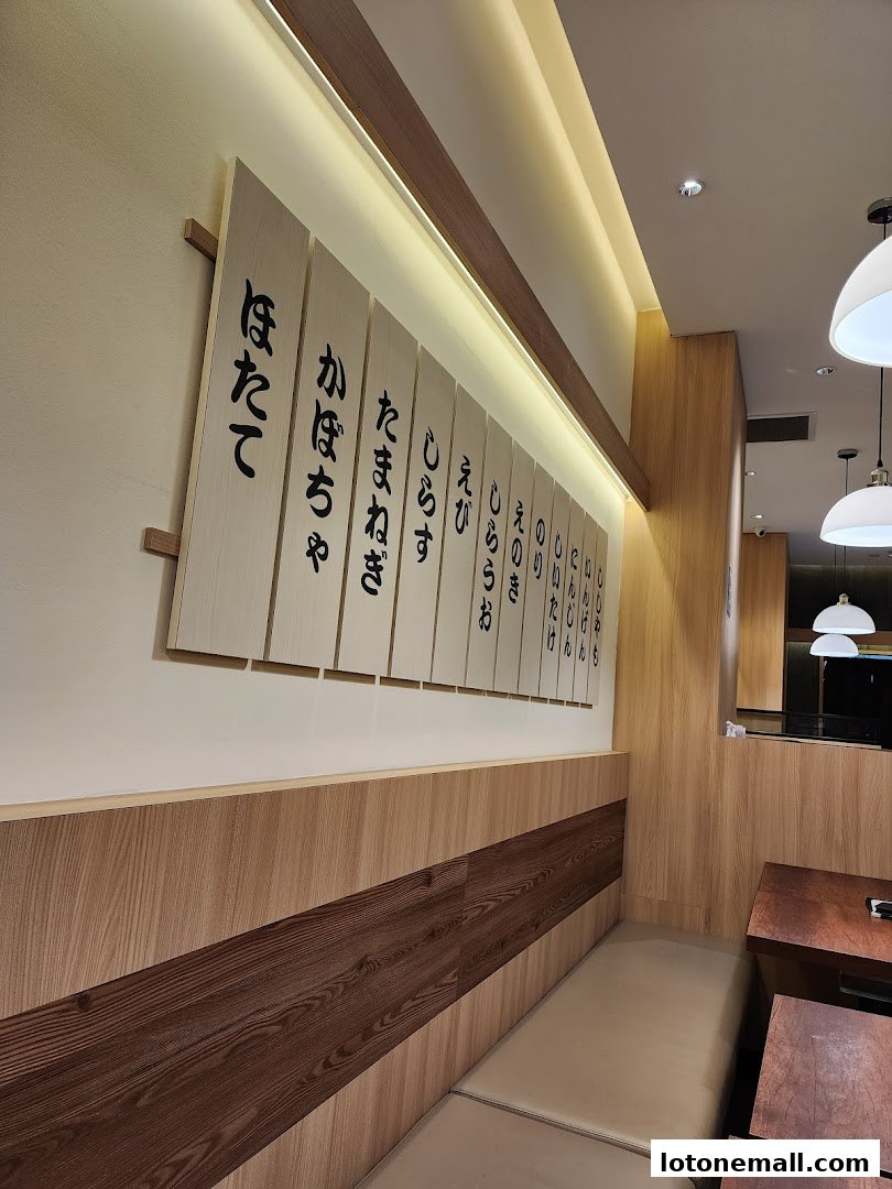 Interior shot of Milan Shokudo with Japanese calligraphy on wooden boards.