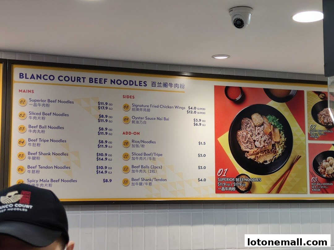 A menu board for Blanco Court Beef Noodles, showcasing various beef noodle dishes and sides.