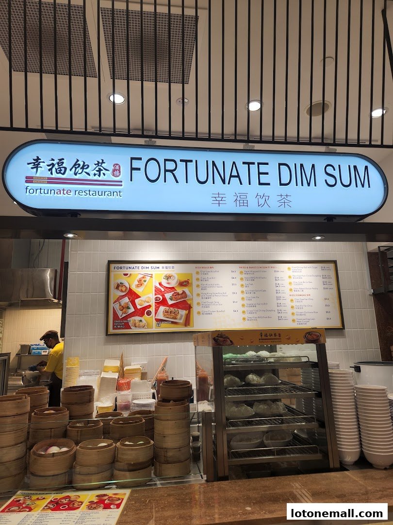 A food stall with a sign for Fortunate Dim Sum, displaying dim sum and a menu.